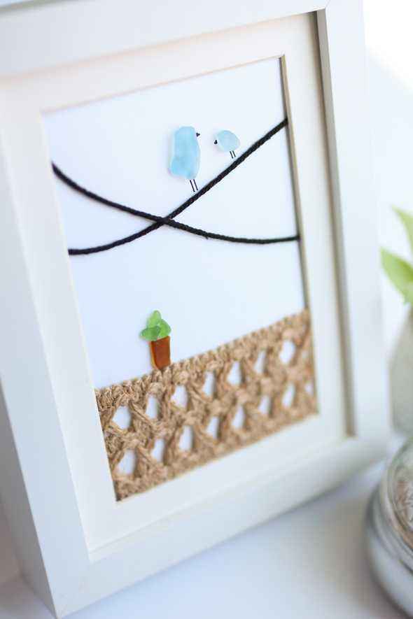 Sea Glass artwork of two birds in a frame