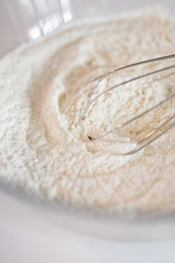 bowl filled with flour mixture and a whisk