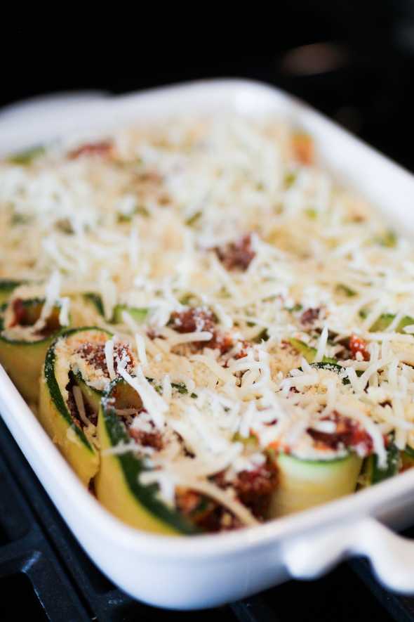 casserole dish filled with baked lasagna zucchini rolls