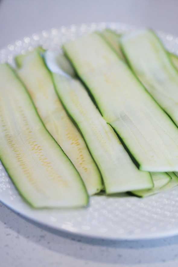 zucchini slices on a white plate