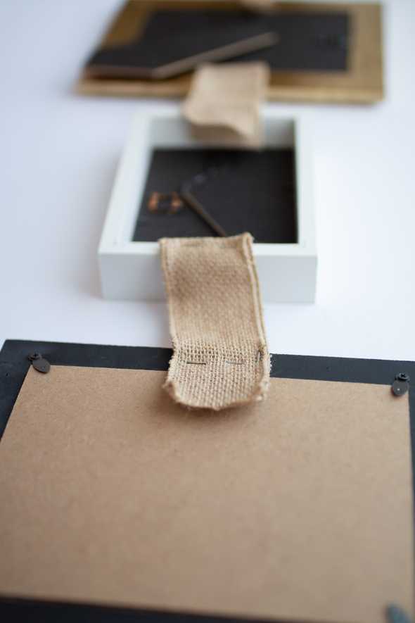 close up of burlap ribbon stapled to a picture frame