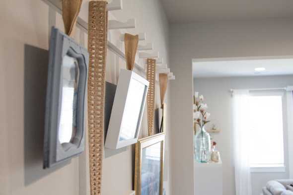side view of picture frames hanging on the wall