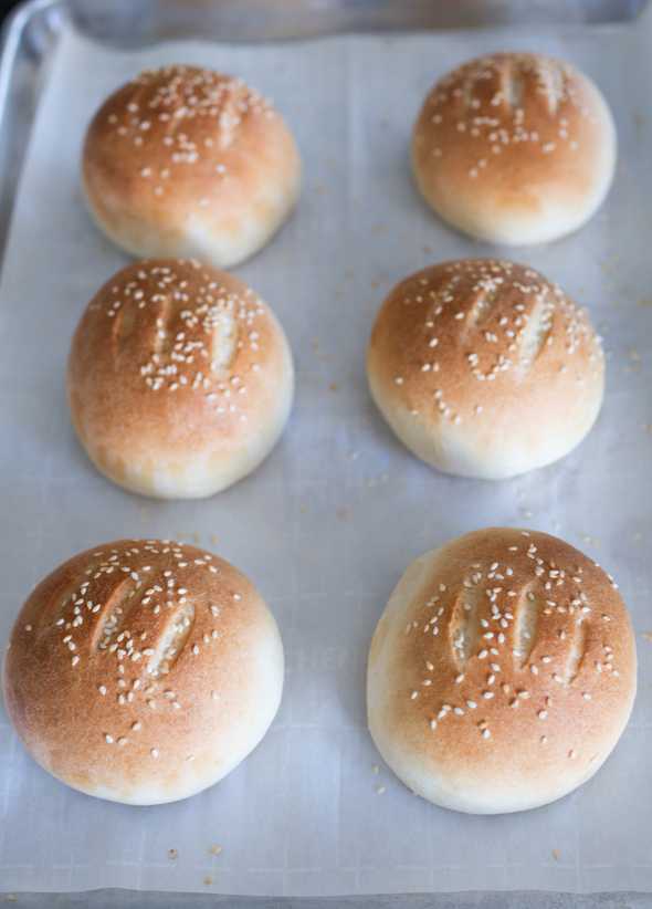 baked hamburger buns on a cookie sheet